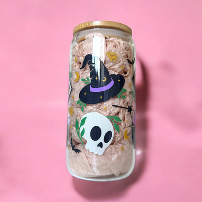 Witchcraft Iced Coffee Glass Cup with witch hat and skull design on pink background